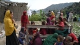 Injured Afghan women and girls sit as they receive medical treatment following an earthquake in the Mazar Dara village in Kunar province, Afghanistan.