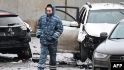 An investigator works at the site of a car blast in southern Moscow that killed Russian Lieutenant General Fanil Sarvarov on December 22. 