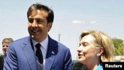 Georgian President Mikheil Saakashvili (left) welcomes U.S. Secretary of State Hillary Clinton to Tbilisi.