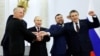 Руският президент Владимир Путин с назначените от Русия лидери на окупационните власти в Донецка, Луганска, Херсонска и Запорожка област