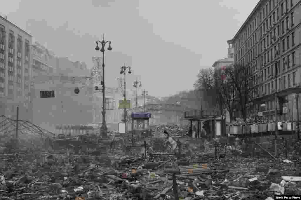 French photographer Jerome Sessini won Second Prize in the Spot News category for this photo of a deserted avenue in the Maidan, as the square in central Kyiv at the center of antigovernment protests in late-2013-14 is known, after violent clashes between protesters and Ukrainian security forces.