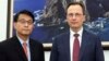 Yoon Sang-hyun (left), chairman of the South Korean parliament's Foreign Affairs Committee, and Russia's acting Ambassador Maksim Volkov in Seoul on July 24
