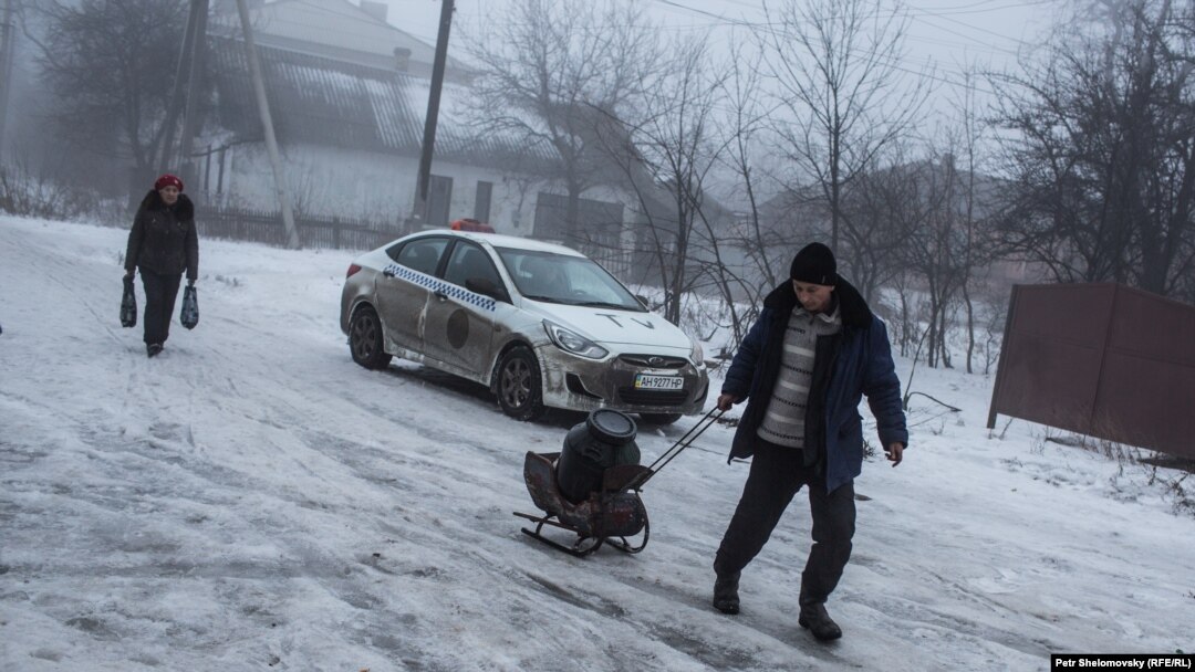 The eastern Ukrainian town of Debaltseve is at the center of the latest clashes between the Ukrainian military and pro-Russian separatists. As shells strike residential areas, some civilians have retreated to their basements for safety. Many have been living without electricity, gas, or water for over a week. Photojournalist Petr Shelomovskiy covered the harsh realities of daily life in Debaltseve for RFE/RL's Current Time TV program.