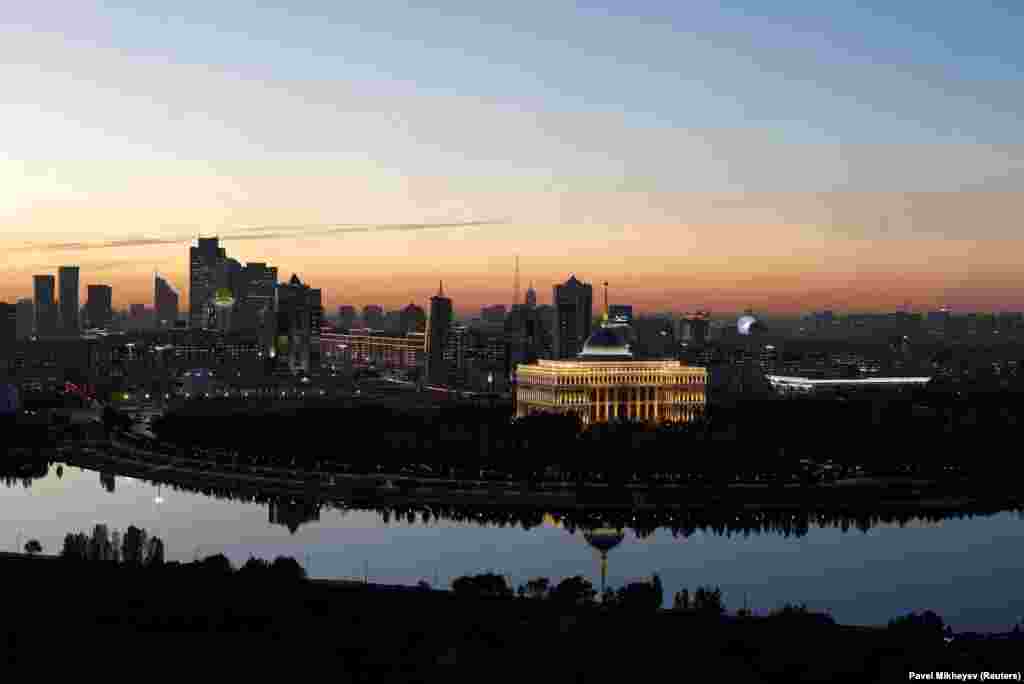 The sun sets over the Kazakh capital, Astana, with the presidential residence in the foreground.&nbsp;