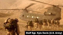 FILE: U.S. troops boarding a Chinook helicopter in the southern province of Kandahar.