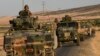 Massing Of Turkish Troops On Border With Syrian Kurds Draws Protests