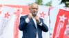 Former Moldovan President Igor Dodon speaks at a campaign rally in Chisinau in the run-up to last weekend's parliamentary elections, which were won by a pro-European grouping founded by the current president, Maia Sandu. 