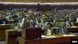 Pakistani Prime Minister Nawaz Sharif (left) speaks in parliament in Islamabad on January 29.