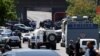 Armenia -- Armenian police officers with armored vehicles block a street leading to a seized police station in the district of Erebuni in Yerevan, Armenia, 17 July 2016. 