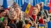 Moldova -- People wave flags as they attend a Pro-European meeting on the 'Square of the Big National Assembly' in Chisinau, November 3, 2013