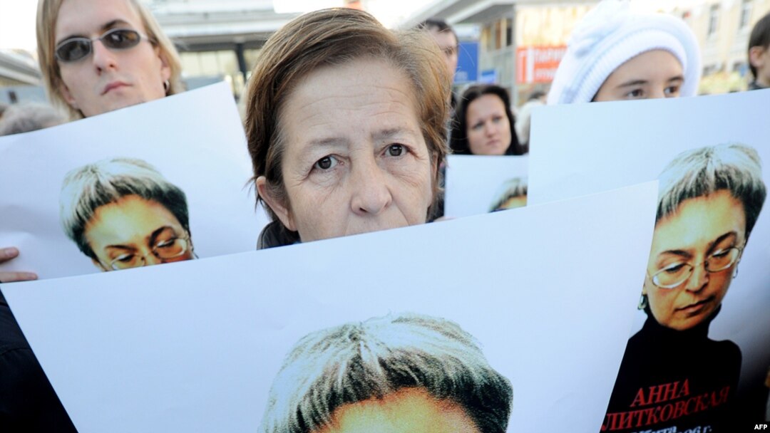 Human rights activists at a rally in honor of slain Russian journalist Anna Politkovskaya in Moscow in 2010.