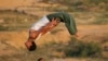 Palestine -- Palestinian boys demonstrate their parkour skills in Gaza City, January 22, 2016