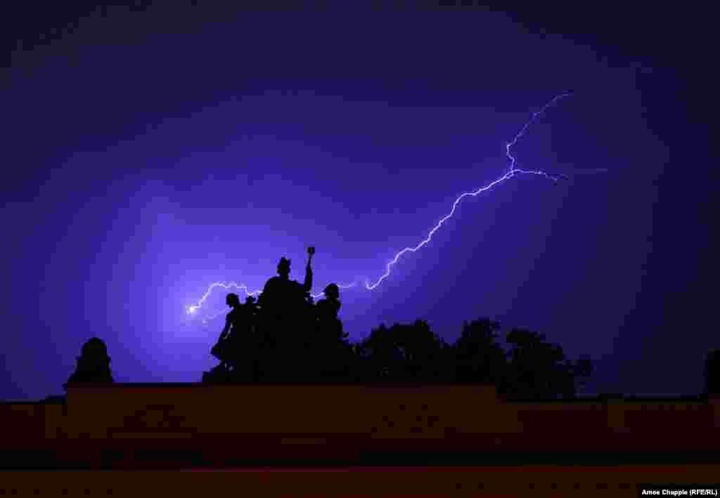 Lightning cuts through the clouds during a heavy thunderstorm in Prague on June 22. (RFE/RL/Amos Chapple)