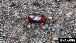 IA child's shoe is pictured at the scene of a Ukrainian airliner that crashed shortly after take-off near Tehran.