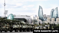 Azerbaijan -- A column of military vehicles rolls during a rehearsal of a military parade in Baku, 21Jun2013