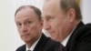 Russia -- Russian Security Council Secretary Nikolai Patrushev (L) looks at President Vladimir Putin during a meeting with the BRICS countries' senior officials in charge of security matters at the Kremlin in Moscow, Russia, May 26, 2015