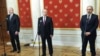 Russian President Vladimir Putin (center), Azerbaijani President Ilham Aliyev (right), and Armenian Prime Minister Nikol Pashinian attend a joint press conference following a trilateral meeting at the Kremlin in Moscow on January 11. 