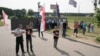 Protesters rally against building of a restaurant near Kurapaty memorial to the victims of Stalinist repressions on June 25.