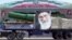 A military truck carrying a warhead and a picture of Iran's Supreme Leader Ayatollah Ali Khamenei is seen during a parade in Tehran late last year. Washington says the new sanctions have been imposed as a result of Iran's ballistic missile program. 