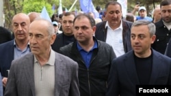Armenia - Former President Robert Kocharian (left) and senior members of his Hayastan bloc campaign in Abovian, May 17, 2026.