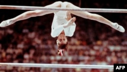 Romanian gymnast Nadia Comaneci, 14, takes the world by storm at the Montreal Olympics in 1976. 