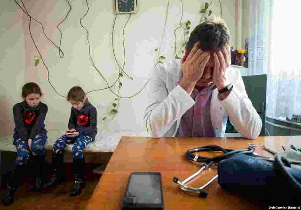 Two young patients waiting to be seen by Rozumiy. Some of the reforms are aimed at boosting the earnings of doctors who service more patients and allowing more patients to choose doctors and hospitals themselves.