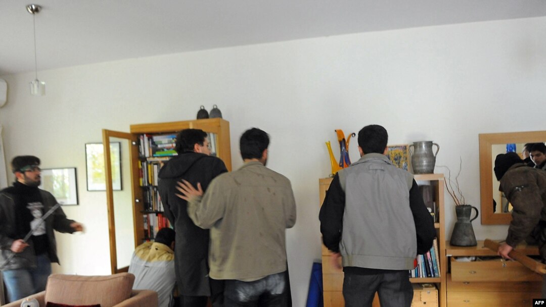 Iran -- Protesters search an office at the British embassy in Tehran, 29Nov2011