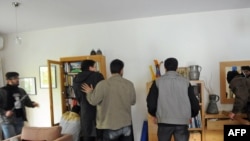 Iran -- Protesters search an office at the British embassy in Tehran, 29Nov2011