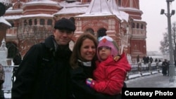 Kendra Skaggs and her husband, Jason, pose on Red Square with 5-year-old Polina, now known as Polly.