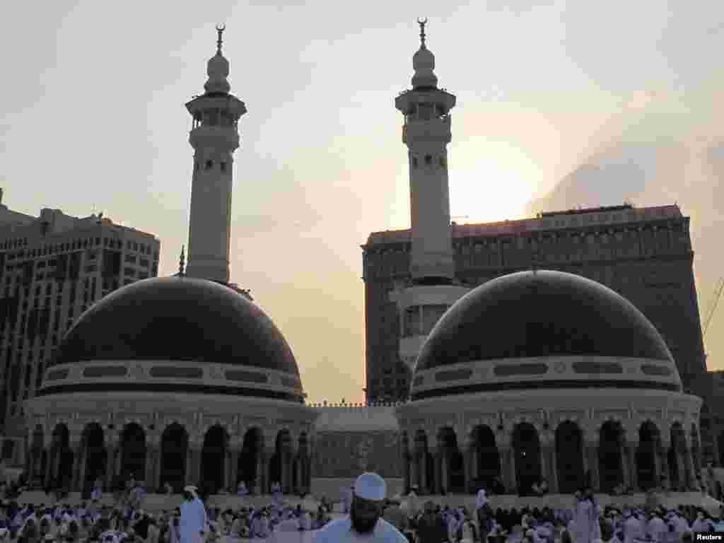 Saudi Arabia -- Muslim pilgrims gather at the Grand mosque in Mecca, during the annual haj pilgrimage, 19Nov2010 - Muslim pilgrims gather at the Grand mosque in Mecca, during the annual haj pilgrimage, November 19, 2010. Millions flock to Mecca in Saudi Arabia for the annual haj pilgrimage, a duty for every able-bodied Muslim who can afford it. Muslims around the world celebrate Eid al-Adha to mark the end of the haj by slaughtering sheep, goats, cows and camels to commemorate Prophet Abraham's willingness to sacrifice his son Ismail on God's command. REUTERS/Fahad Shadeed (SAUDI ARABIA - Tags: RELIGION)