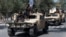 Naoružani talibanski borci u paradi na vozilima, Kabul 2022. godine.