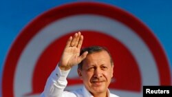 Turkey -- Turkey's Prime Minister and presidential candidate Tayyip Erdogan greets his supporters during an election rally in Istanbul August 3, 2014. 