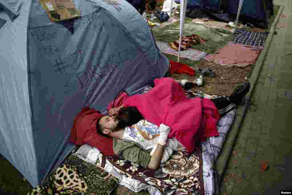 Antigovernment protesters sleep near tents at Gezi Park near Taksim Square in Istanbul. (Reuters/Stoyan Nenov)