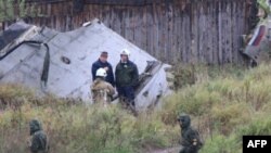 Investigators at the crash scene in Perm