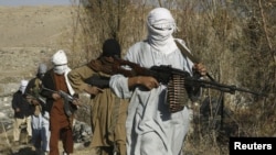 Taliban fighters pose with their weapons in Afghanistan's Nangarhar Province. (file photo)