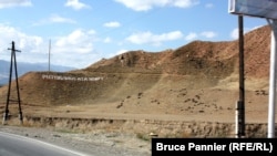 A hillside campaign ad for the Respublika Ata Jurt party on the road to Batken in southern Kyrgyzstan. 