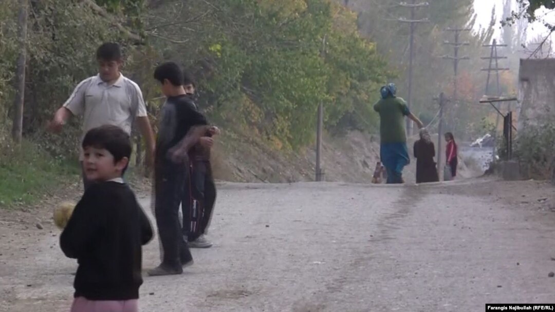 Children play along a roadside in Isfara district. There is little else to do in the town, which has no movie theater or mall.
