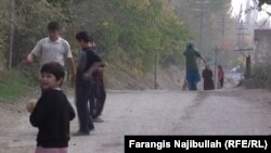 Children play along a roadside in Isfara district. There is little else to do in the town, which has no movie theater or mall.