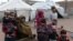 Internally displaced Afghan children gather near their tent on the outskirts of Jalalabad. 
