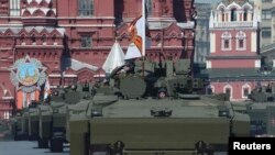 Russian Kurganets-25 armored personnel carriers drive during the Victory Day parade at Red Square in Moscow on May 9. 