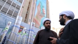 Clerics stand next to a model missile and a nuclear enrichment centrifuge during a rally outside the former US embassy in Tehran as Iranians mark the 46th anniversary of the start of the Iran hostage crisis, on November 4