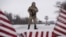 A Ukrainian guard stands ready at the border in Milove.