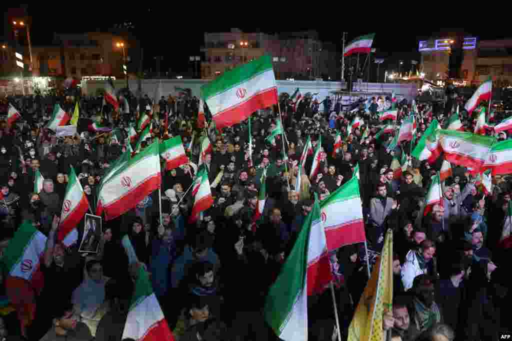 Iranians gather on Enqelab Square in Tehran on April 8 reacting to news of the temporary cease-fire between Washington and Tehran.