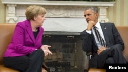 U.S. President Barack Obama (right) met at the White House on February 9 with German Chancellor Angela Merkel to discuss the crisis in Ukraine.