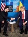  Ukrainian President Volodymyr Zelenskyy (left) shakes hands with US President Donald Trump during their meeting on the sidelines of the NATO summit in The Hague on June 25. 