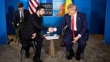  Ukrainian President Volodymyr Zelenskyy (left) shakes hands with US President Donald Trump during their meeting on the sidelines of the NATO summit in The Hague on June 25. 