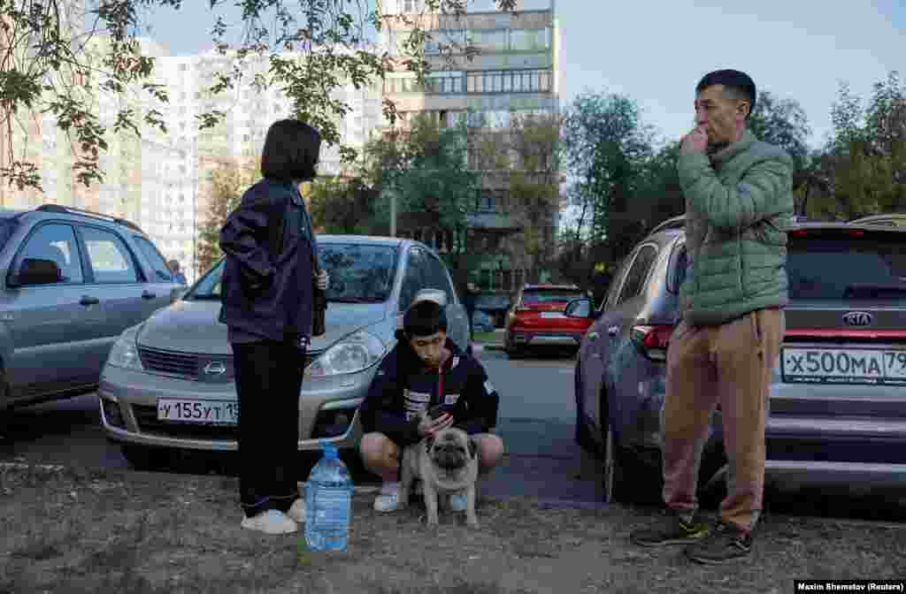 Residents await clearance to return to their homes following the drone attack. The conflict has seen Russia launch thousands of missiles and drone strikes on Ukraine, targeting civilian infrastructure and killing thousands. &nbsp;