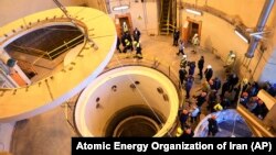 Officials and media visit the heavy-water reactor's secondary circuit near Arak, Iran, in 2019.