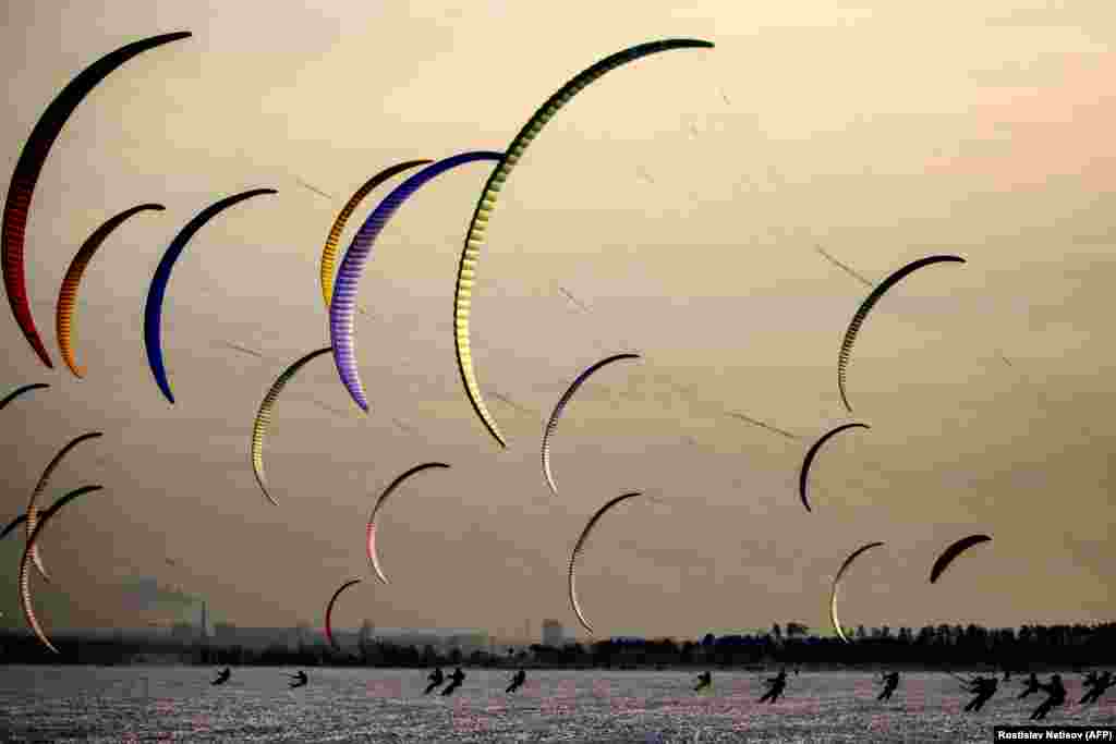 Kiters take part in the annual Siberia cup outside the Russian city of Novosibirsk on December 6. (AFP/Rostislav Netisov)