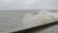 На міській набережній &ndash; пориви шквального вітру, на морі сильне хвилювання, хвилі захльостують бетонну огорожу